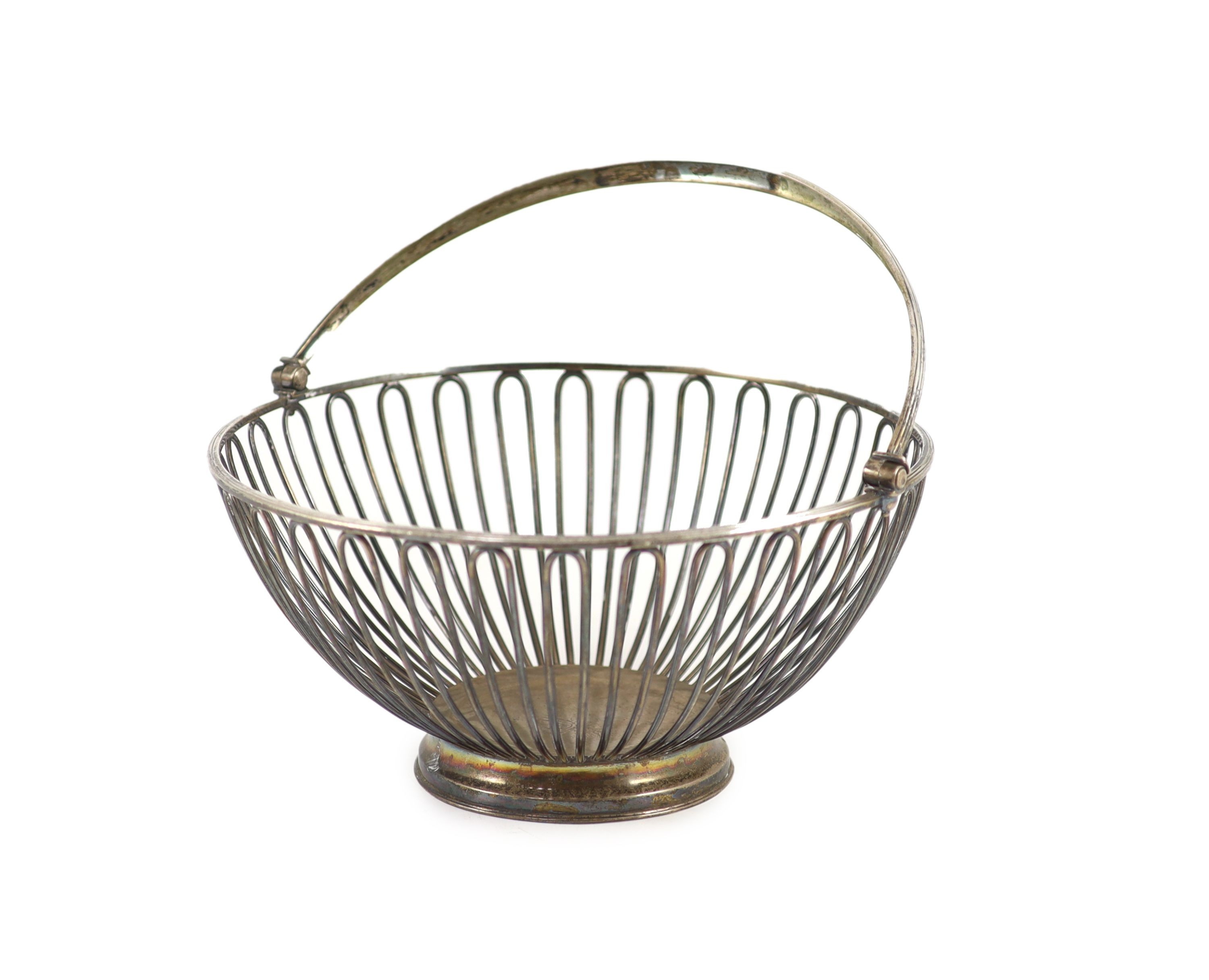 A George III silver wire work circular fruit basket, by Wakelin & Garrard